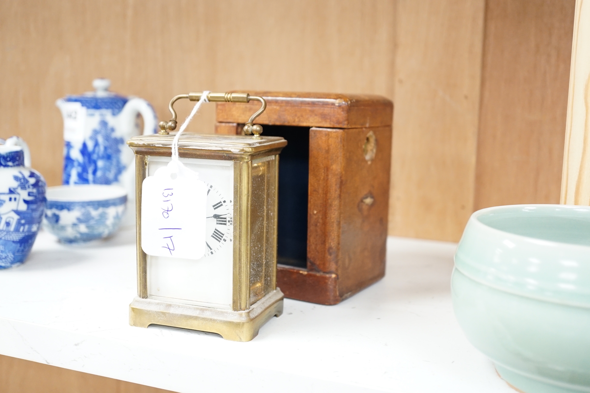 An early 20th century French lacquered brass carriage timepiece, cased, 11cm high